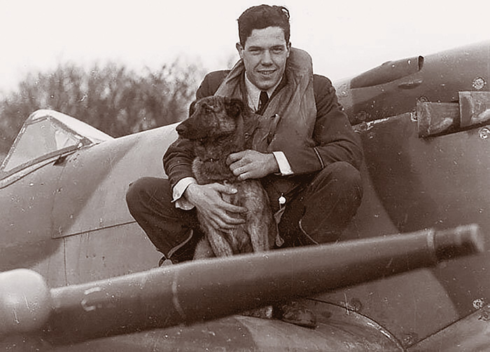 RCAF Pilot Officer Hugh Constant Godefroy and the 403 Squadron mascot.